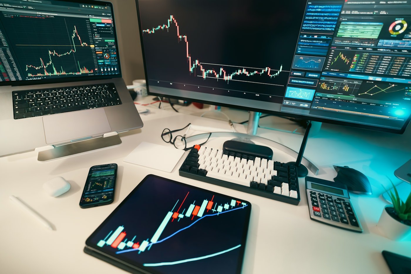 Trading and monitoring screens at a financial services desk.