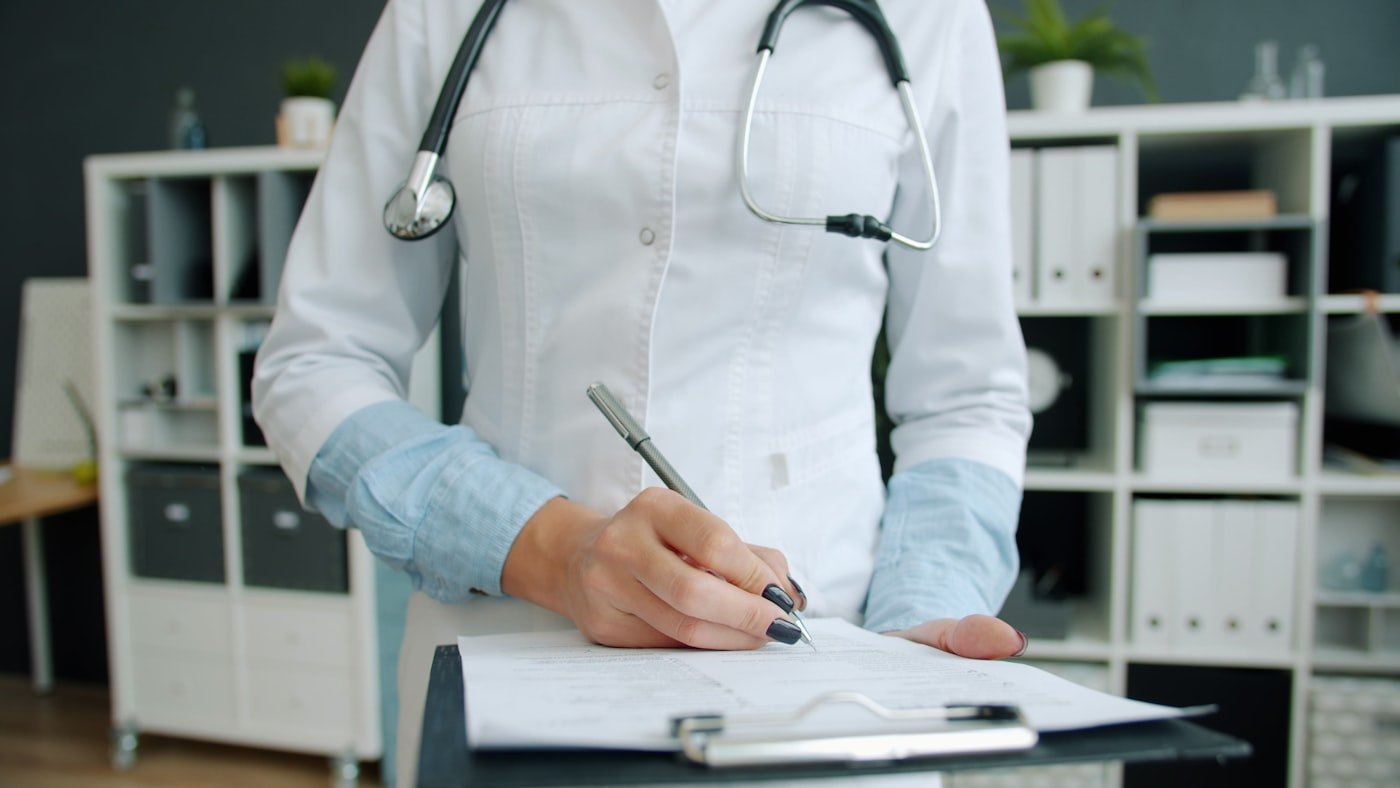 Caseworker reviewing eligibility documentation.